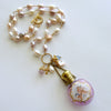 #1 Violetta Necklace - Pink Pearls Cherub Scent Bottle Necklace